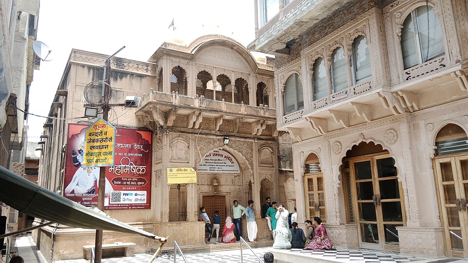 The carved sandstone facade of Radha Raman Temple in its Vrindavan lane